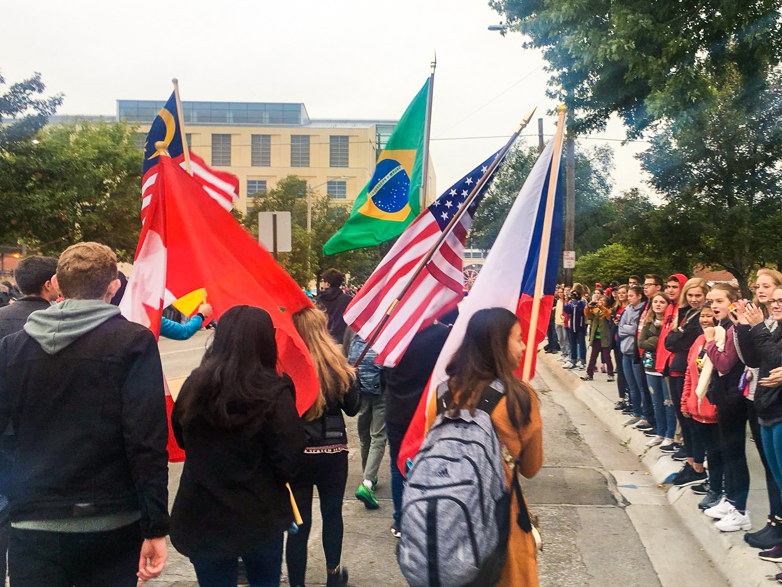International students marching with their flags at Homecoming Parade