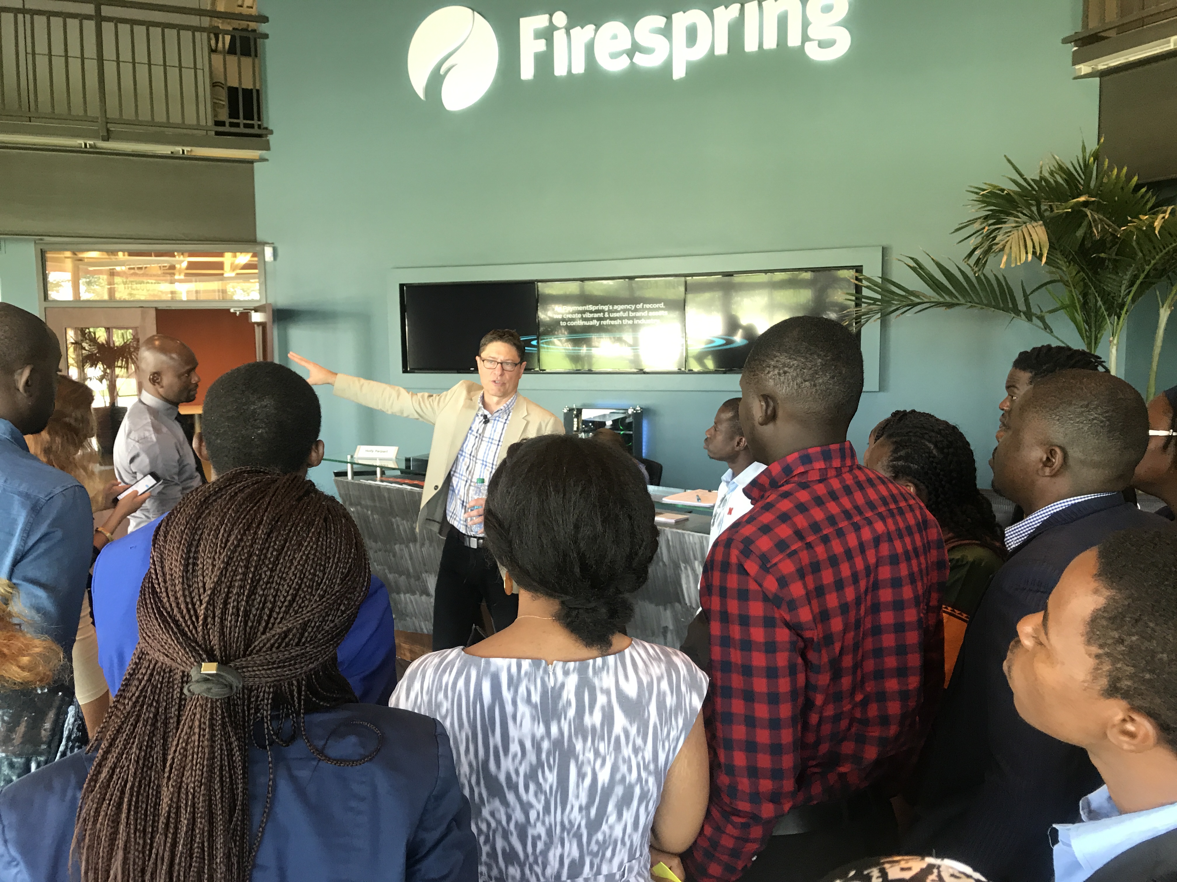 Several Mandela Washington Fellows listen to Firespring founder on the company's headquarters