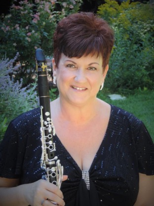 Diane Barger is holding a clarinet.