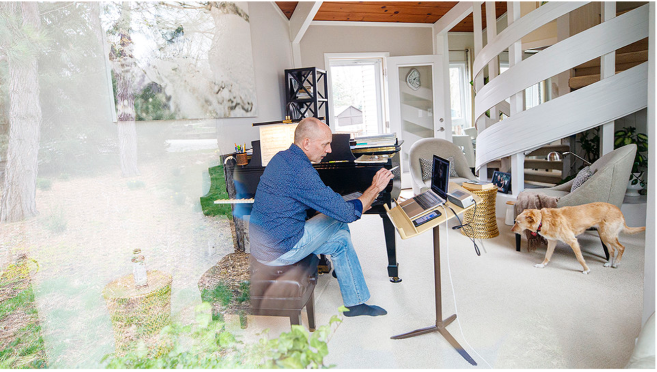 The University of Nebraska–Lincoln's Paul Barnes sits at the Steinway piano in his home while teaching a one-on-one lesson with student Cameron Berta, who returned home to Dallas in the wake of the university's shift to remote instruction.