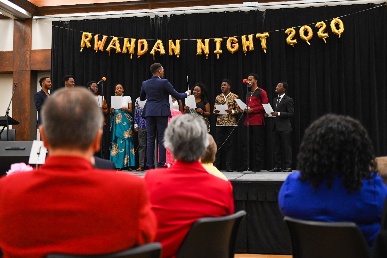 Chancellor Ronnie Green and the Ambassador of Rwanda Mathilde Mukantabana pose with Rwandan students at the end of the first Rwanda Night celebration. 