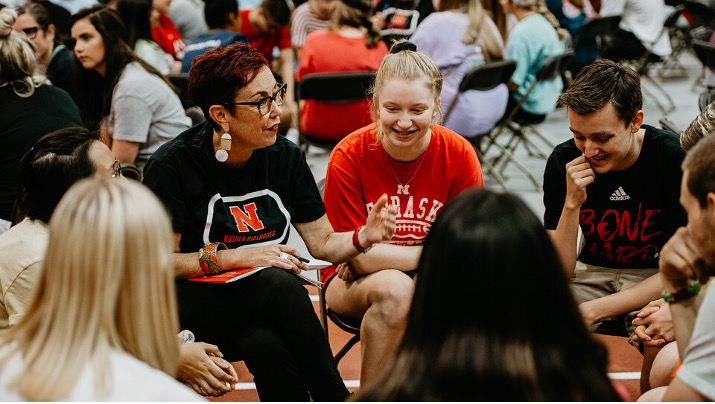 Megan Elliott, director of the Johnny Carson Center for Emerging Media Arts, guides a Husker Dialogues discussion in the Devaney Sports Center at the start of the fall 2019 semester. 