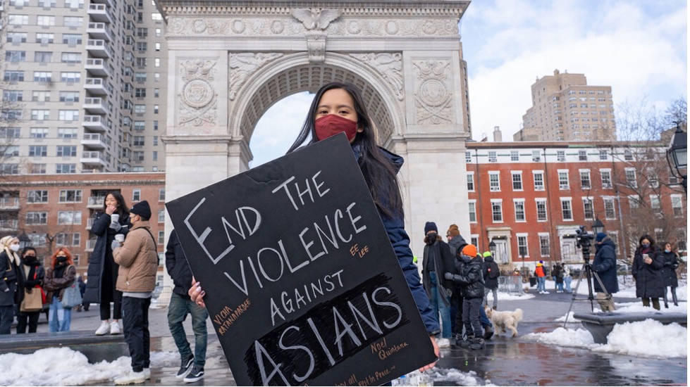 A protestor holds a sign at the End The Violence Towards Asians rally in Washington Square Park on Feb. 20, in New York City.