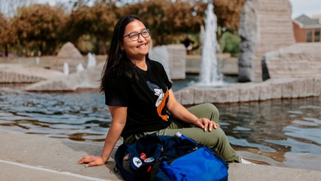 Sandhya Karki sits by the fountain in Nebraska City Campus Union.