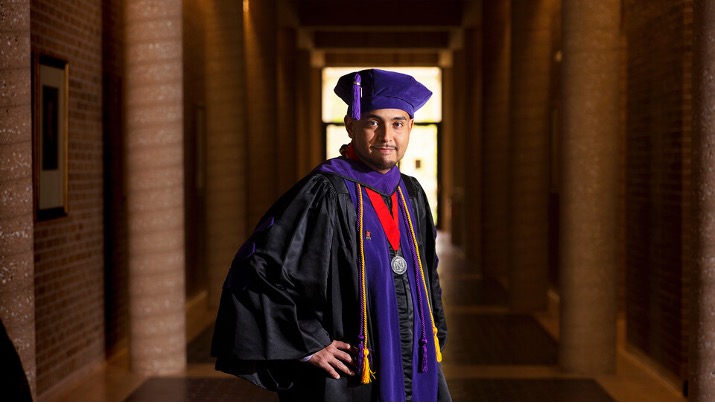 Mauricio Murga Rios wears his cap and gown for the 2021 Spring Commencement. 