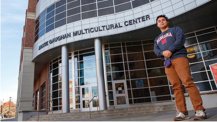 Fernando Wisniewski-Pena stands in front of the Jackie Gaughan Multicultural Center, which houses the Office of Academic Success and Intercultural Services.
