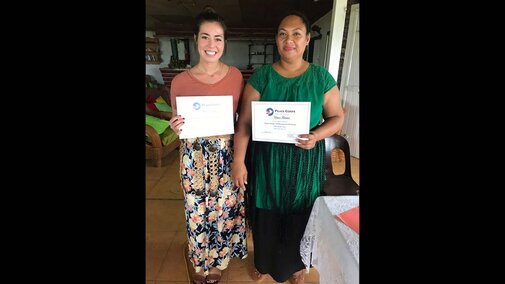 Michaela Dreezen and another holding certificates