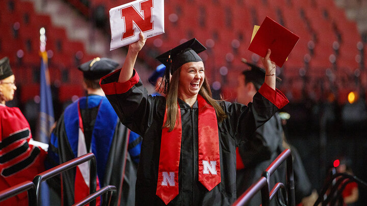 Nicole Colonna celebrates after receiving her degree during the summer commencement ceremony Aug. 17 at Pinnacle Bank Arena. She earned a Bachelor of Science in Education and Human Sciences.