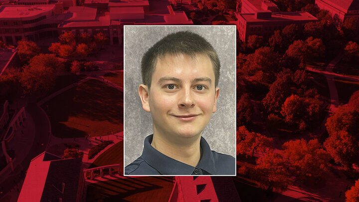 Color portrait of Alex Wagner, first-year global studies major and Critical Language Scholar, on a red campus background.