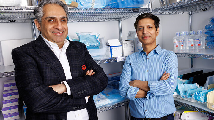 Amit Saini, left, and Alok Kumar, professors in the Department of Marketing at the College of Business, stand next to medical supplies inside the Nebraska Medicine University Health Center. Saini and Kumar explore how group purchasing organizations can enhance supply chain efficiency and reduce patient care costs.