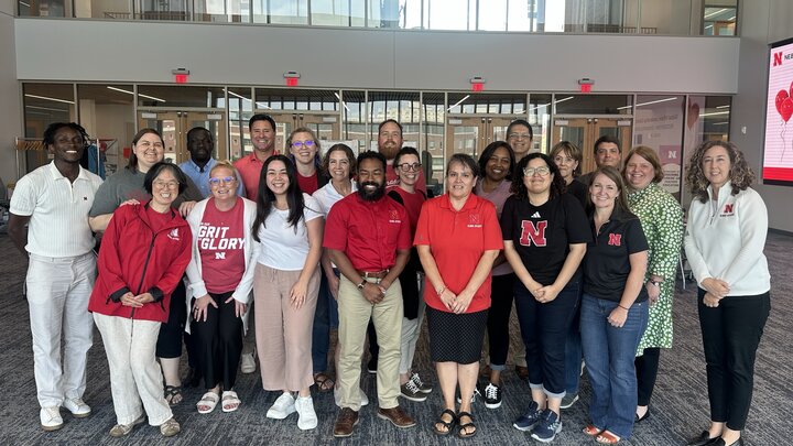 Team poses for photo during conference.