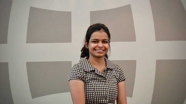 Dr. Deepa Choudhry posing in front of NuTech Ventures sign