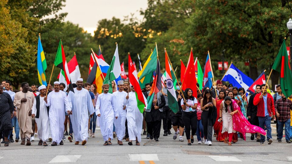 Homecoming International Students with flags in parade