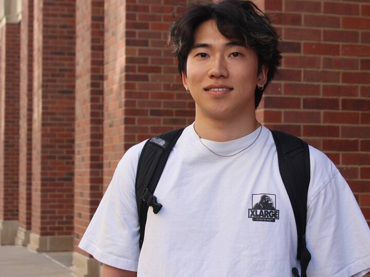 Shu PIESL Student is posing at Louise Pound Hall