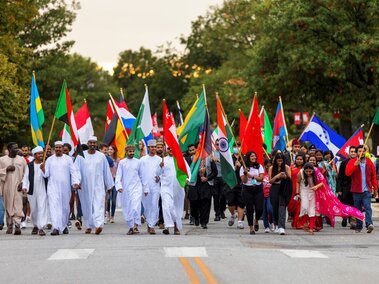 Homecoming International Students with flags in parade