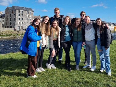 Kelly Durkin with group of students overseas