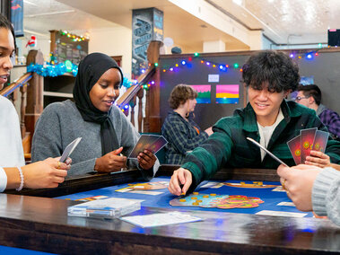 students playing board game