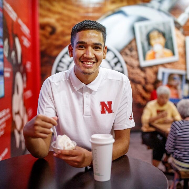 Student on East Campus eating ice cream at the Dairy Store
