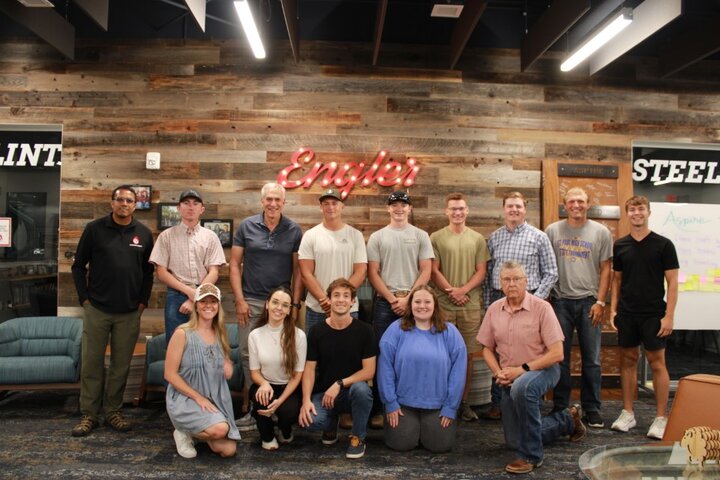 Engler students, faculty, and staff pictured with Alvarez and Ramirez.