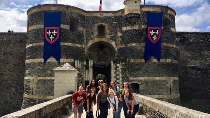 French group of students in front of castle