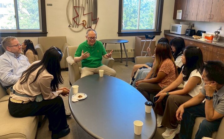 Students and staff speaking with the Honorable Ambassador.