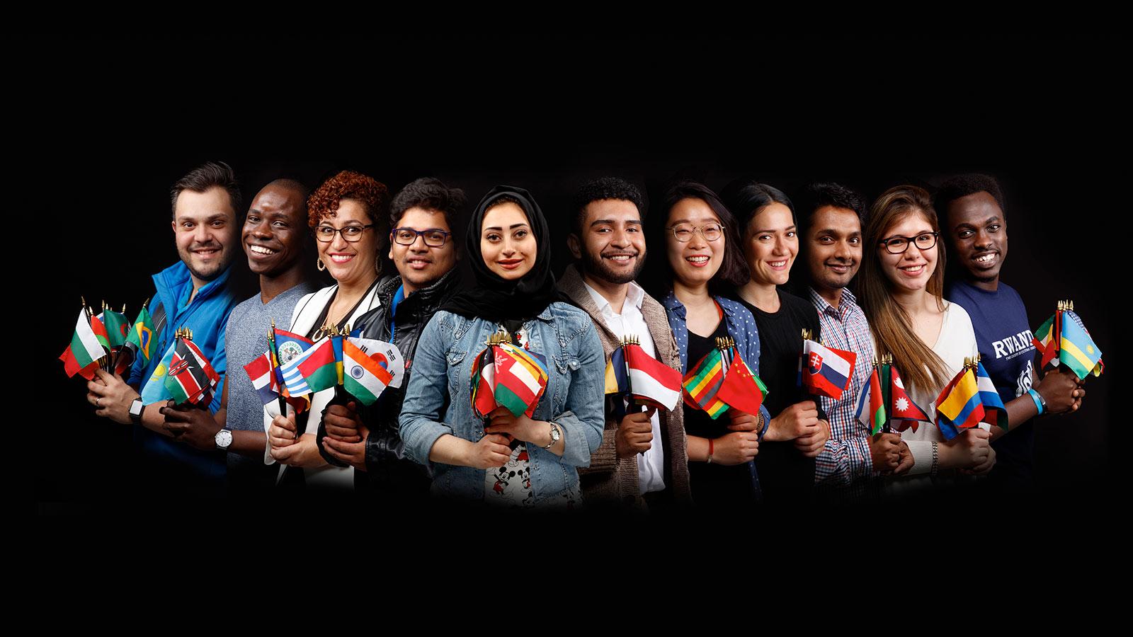 International students and faculty holding their country's flags
